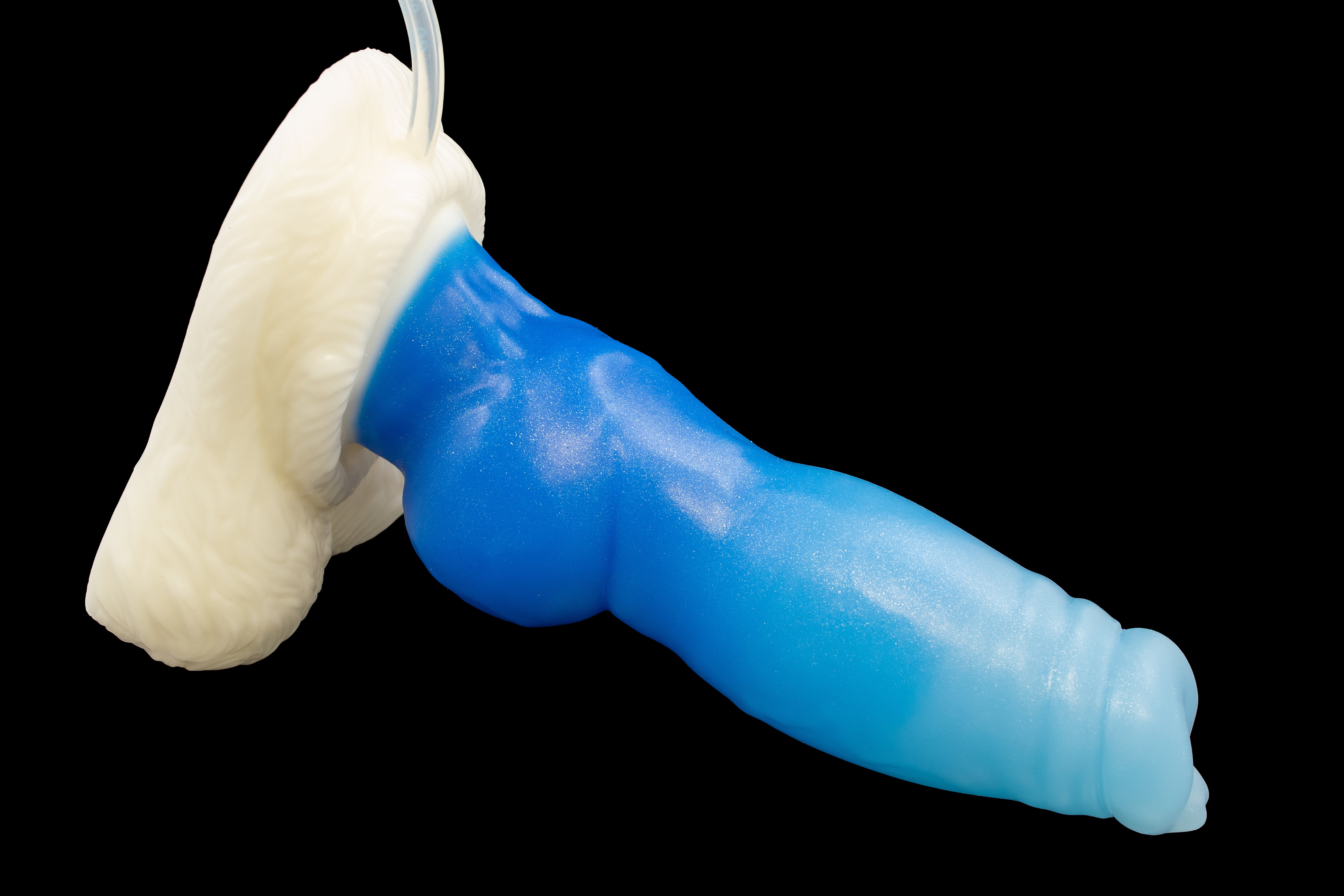 A medium-firmness mini sized direwolf dildo with a cum tube, featuring a combination of white base and faded blue-lightblue sparkling shaft colors.